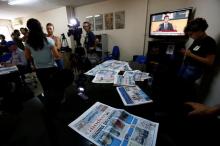 A journalist of pro-Kurdish Ozgur Gundem gives an interview to a German TV channel at their newsroom before a protest against the arrest of three prominent campaigners for press freedom, in front of the pro-Kurdish Ozgur Gundem newspaper in central Istanbul, Turkey, June 21, 2016. PHOTO BY REUTERS/Murad Sezer