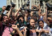 Egyptian journalists hold up their cameras outside the Egyptian Press Syndicate in downtown Cairo, Egypt April 28, 2016, during a protest against the interior minister following the arrest of colleagues for covering anti-government demonstrations. PHOTO BY REUTERS/Mohamed Abd El Ghany
