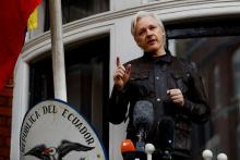 WikiLeaks founder Julian Assange is seen on the balcony of the Ecuadorian Embassy in London, Britain, May 19, 2017. PHOTO BY REUTERS/Peter Nicholls