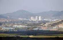 Kaesong city is seen behind the inter-Korean Kaesong Industrial Complex, across the demilitarised zone (DMZ) separating North Korea from South Korea in this picture taken from Dora observatory in Paju, 55 km (34 miles) north of Seoul, September 25, 2013. PHOTO BY REUTERS/Lee Jae-Won