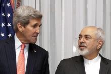 U.S. Secretary of State John Kerry (L) and Iran's Foreign Minister Mohammad Javad Zarif pose for a photograph before resuming talks over Iran's nuclear program in Lausanne, March 16, 2015. PHOTO BY REUTERS/Brian Snyder