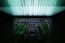 A man types on a computer keyboard in Warsaw in this February 28, 2013 illustration file picture. PHOTO BY REUTERS/Kacper Pempel