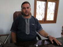 Khaled Dayamous, 33, owner of a woven mat factory poses in his office in Idlib province, Syria, July 29, 2018. PHOTO BY REUTERS/Khalil Ashawi