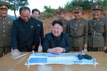 North Korean leader Kim Jong Un reacts during the long-range strategic ballistic rocket Hwasong-12 (Mars-12) test launch with Ri Pyong Chol (2nd L), Kim Jong Sik (C) and Jang Chang Ha (2nd R). in this undated photo released by North Korea's Korean Central News Agency (KCNA) on May 15, 2017. PHOTO BY REUTERS/KCNA 