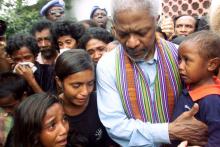 United Nations Secretary-General Kofi Annan consoles family members of victims of last April's massacre by pro-Indonesia militia in Liquisa, 30 km west of Dili, February 17, 2000. PHOTO BY REUTERS/Darren Whiteside