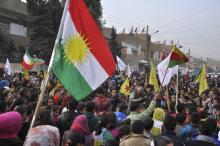 Kurdish civilians gather in the Syrian Kurdish city of Qamishli as they wave Kurdish flags in celebration after it was reported that Kurdish forces took control of the Syrian town of Kobani, January 27, 2015. PHOTO BY REUTERS/Delil Souleiman