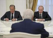 Russian President Vladimir Putin (R), Foreign Minister Sergei Lavrov (L) and Syrian Foreign Minister Walid al-Muallem (back to camera) attend a meeting at the Kremlin in Moscow, Russia, June 29, 2015. PHOTO BY REUTERS/Alexei Nikolsky