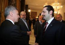 Lebanon's then-Prime Minister Saad al-Hariri (R) chats with Lebanese Christian politician and leader of the Marada movement Suleiman Franjieh (L) as Head of Hezbollah's parliamentary bloc Mohamed Raad (2nd L), MP Assaad Hardan (C) and Lebanon's Parliament Speaker Nabih Berri listen during a new session of the national dialogue between political leaders at the Presidential Palace in Baabda, near Beirut, April 15, 2010. REUTERS/Dalati Nohra