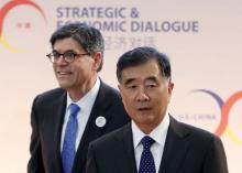 U.S. Treasury Secretary Jack Lew (L) and Chinese Vice Premier Wang Yang arrive at the Strategic and Economic Dialogue (S&ED) at the State Department in Washington, June 23, 2015. PHOTO BY REUTERS/Yuri Gripas