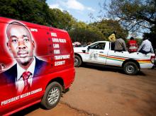 Vehicles display the logos for Zimbabwean opposition Movement For Democratic Change (MDC) party, and the ruling ZANU PF party outside an election nomination court in Harare, Zimbabwe, June 14, 2018. PHOTO BY REUTERS/Philimon Bulawayo