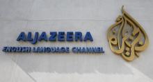 The logo of Qatar-based Al Jazeera satellite news channel is seen in Doha, February 7, 2011. PHOTO BY REUTERS/ Fadi Al-Assaad
