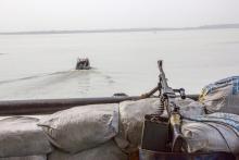 A machine gun is seen on a sandbag on a boat off the Atlantic coast in Nigeria's Bayelsa state, December 19, 2013. PHOTO BY REUTERS/Stringer