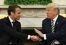 French President Emmanuel Macron (L) and U.S. President Donald Trump shake hands during their meeting in the Oval Office following the official arrival ceremony for Macron at the White House in Washington, U.S., April 24, 2018. PHOTO BY REUTERS/Kevin Lamarque