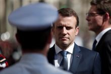 French President Emmanuel Macron attends a ceremony to pay tribute to Xavier Jugele one year after the French police officer was killed during a shooting incident, on the Champs Elysees avenue in Paris, France, April 20, 2018. PHOTO BY REUTERS/Benoit Tessier