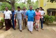 Sri Lanka's former President Mahinda Rajapaksa (3rd R) arrives at a polling station during the general election in Medamulana, August 17, 2015. PHOTO BY REUTERS/Stringer