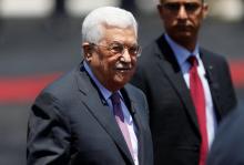 Palestinian President Mahmoud Abbas stands during a reception ceremony for Jordan's King Abdullah II in the West Bank city of Ramallah, August 7, 2017. PHOTO BY REUTERS/Mohamad Torokman