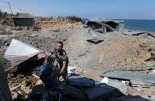 A Palestinian man inspects a destroyed Islamic Jihad military base after it was targeted by an Israeli warplane, at the southern Gaza Strip, May 30, 2018. PHOTO BY REUTERS/Ibraheem Abu Mustafa