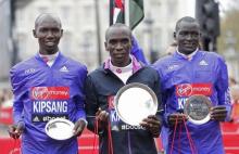 Kenya's Eliud Kipchoge (1st), Kenya's Wilson Kipsang (2nd) and Kenya's Dennis Kimetto (3rd) pose with their trophies after the Men's Elite race. PHOTO BY REUTERS/Suzanne Plunkett Livepic