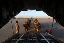 U.S. Marines prepare to board a plane at the end of operations for U.S. Marines and British combat troops in Helmand, October 26, 2014. PHOTO BY REUTERS/Omar Sobhani