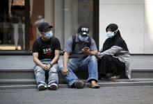 Tourists wearing masks to prevent contracting Middle East Respiratory Syndrome (MERS) rest at Myeongdong shopping district in central Seoul, South Korea, June 12, 2015. PHOTO BY REUTERS/Kim Hong-Ji