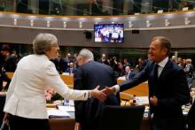 British Prime Minister Theresa May shakes hands with European Council President Donald Tusk at the EU summit in Brussels, Belgium, June 23, 2017. PHOTO BY REUTERS/Gonzalo Fuentes