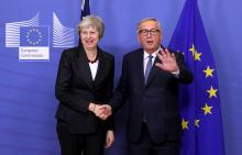 British Prime Minister Theresa May shakes hands with European Commission President Jean-Claude Juncker before a meeting to discuss draft agreements on Brexit, at the EC headquarters in Brussels, Belgium, November 21, 2018. PHOTO BY REUTERS/Yves Herman