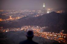 A Muslim pilgrim prays atop Mount Thor in the holy city of Mecca ahead of the annual has pilgrimage, October 11, 2013. PHOTO BY REUTERS/Ibraheem Abu Mustafa