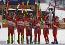 Bronze medallist Norway's team celebrates on the podium. PHOTO BY REUTERS/Leonhard Foeger