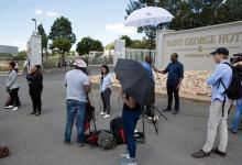 Members of the media gather outside a hotel where members of the African National Congress (ANC) National Executive Committee are meeting to decide the fate of President Jacob Zuma, in Pretoria, South Africa, February 12, 2018. PHOTO BY REUTERS/James Oatway