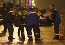 Medics carry the body of Boris Nemtsov, who was shot dead, in central Moscow, February 28, 2015. PHOTO BY REUTERS/Maxim Shemetov