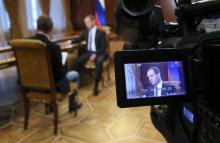 Russian Prime Minister Dmitry Medvedev is seen on a monitor of a TV camera while he speaks during an interview with Russia's Kommersant newspaper at the Gorki state residence outside Moscow, Russia, August 7, 2018. PHOTO BY REUTERS/Sputnik/Ekaterina Shtukina