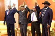 Sudan's President Omar Al-Bashir hold hands with Uganda's President Yoweri Museveni, South Sudan's President Salva Kiir and South Sudan rebel leader Riek Machar during a South Sudan peace meeting as part of talks to negotiate an end to a civil war that broke out in 2013, in Khartoum, Sudan, June 25, 2018. PHOTO BUY REUTERS/Mohamed Nureldin Abdallah
