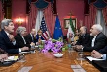 U.S. Secretary of State John Kerry (L), U.S. Secretary of Energy Ernest Moniz (2nd L), Head of the Iranian Atomic Energy Organisation Ali Akbar Salehi (2nd R) and Iranian Foreign Minister Javad Zarif (R) wait with others ahead of a meeting at the Beau Rivage Palace Hotel in Lausanne on March 26, 2015 during negotiations on the Iranian nuclear programme. PHOTO BY REUTERS/Brendan Smialowski