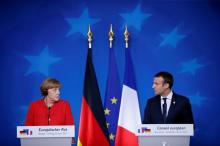 German Chancellor Angela Merkel and French President Emmanuel Macron addresses a joint news conference at the EU summit in Brussels, Belgium, June 23, 2017. PHOTO BY REUTERS/Gonzalo Fuentes