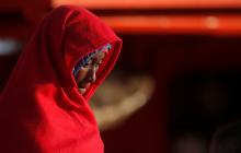 A migrant woman, intercepted off the coast in the Mediterranean Sea, disembarks from a rescue boat at the port of Malaga, southern Spain, November 13, 2018. PHOTO BY REUTERS/Jon Nazca