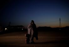 A migrant from Honduras, part of a caravan of thousands traveling from Central America to the United States, prepares to get on a bus bound for Mexicali at a makeshift camp in Navojoa, Mexico, November 17, 2018. PHOTO BY REUTERS/Kim Kyung-Hoon