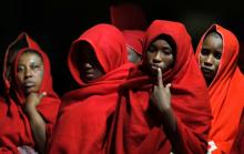 Migrants intercepted off the coast in the Mediterranean Sea wait to disembark from a rescue boat at the port of Malaga, southern Spain, August 28, 2019. PHOTO BY REUTERS/Jon Nazca