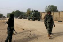 Nigerian military secure the area where a man was killed by suspected militants during an attack around Polo area of Maiduguri, Nigeria, February 16, 2019. PHOTO BY REUTERS/Afolabi Sotunde