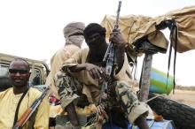Militiamen from the Ansar Dine Islamic group sit on a vehicle in Gao in northeastern Mali, June 18, 2012. PHOTO BY REUTERS/Adama Diarra