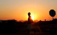 A miner returns from his shift in Nkaneng township outside the Lonmin mine in Rustenburg, northwest of Johannesburg, June 26, 2015. PHOTO BY REUTERS/Siphiwe Sibeko