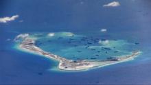 Chinese dredging vessels are purportedly seen in the waters around Mischief Reef in the disputed Spratly Islands in the South China Sea in this still image from video taken by a P-8A Poseidon surveillance aircraft provided by the United States Navy, May 21, 2015. PHOTO BY REUTERS