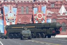 A Russian mobile Topol-M missile launching unit drives during the Victory Day parade in Moscow's Red Square, May 9, 2014. PHOTO BY REUTERS/Grigory Dukor