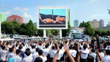 People watch a huge screen showing the test launch of intercontinental ballistic missile Hwasong-14 in this undated photo released by North Korea's Korean Central News Agency (KCNA), July 5, 2017. PHOTO BY REUTERS/KCNA
