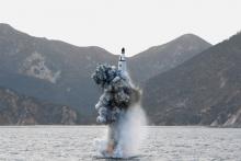 North Korean leader Kim Jong Un guides on the spot the underwater test-fire of strategic submarine ballistic missile. PHOTO BY REUTERS/KCNA