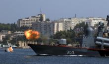 A missile corvette fires during the Navy Day celebrations in Sevastopol, Crimea, July 31, 2016. PHOTO BY REUTERS/Pavel Rebrov