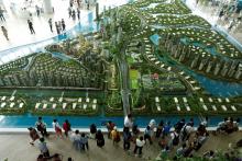Prospective buyers look at a model of the development at the Country Gardens' Forest City showroom in Johor Bahru, Malaysia, February 21, 2017. PHOTO BY REUTERS/Edgar Su