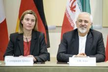 European Union High Representative Federica Mogherini (L) and Iranian Foreign Minister Javad Zarif wait for a meeting with officials from P5+1, the European Union and Iran at the Beau Rivage Palace Hotel in Lausanne March 31, 2015. PHOTO BY REUTERS/Brendan Smialowski