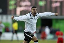 Entente Setif's Mohamed Amine Aouadia celebrate after winning the Algeria Cup final soccer match against CR Belcourt in Algiers