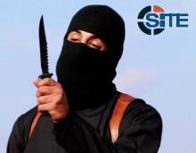 A masked, black-clad militant, who has been identified by the Washington Post newspaper as a Briton named Mohammed Emwazi, brandishes a knife in this still image from a 2014 video obtained from SITE Intel Group, February 26, 2015. PHOTO BY REUTERS/SITE Intel Group
