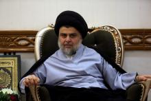 Iraqi Shi'ite cleric Moqtada al-Sadr, who's bloc came first, meets with Iraqi Prime Minister Haider al-Abadi, who's political bloc came third in a May parliamentary election, in Najaf, Iraq, June 23, 2018. PHOTO BY REUTERS/Alaa al-Marjani